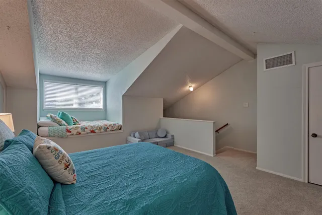 a bedroom with furniture and windows