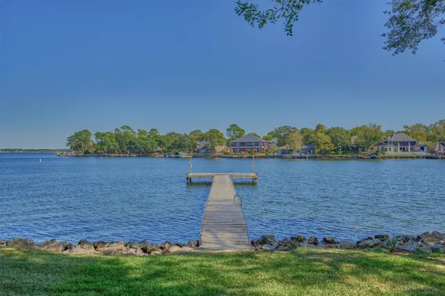 a view of a lake with houses in the background