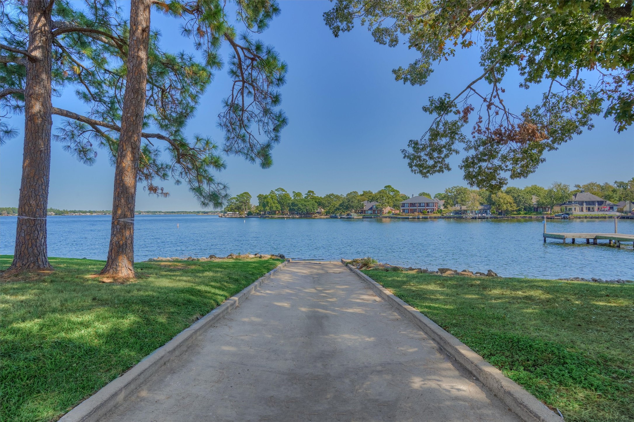 1428 Bowsprit Point Willis, TX 77318 - Photo 41 of 47 a view of a lake with a big yard