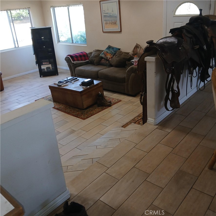 4926 Hedrick Avenue Riverside, CA 92505 - Photo 2 of 10 a living room with furniture and a mirror