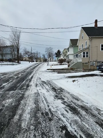 a view of a street with a building
