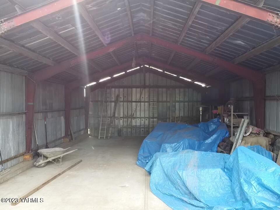 1960 Tear Road Grandview, WA 98930 - Photo 2 of 6 a room with lots of furniture and a chandelier