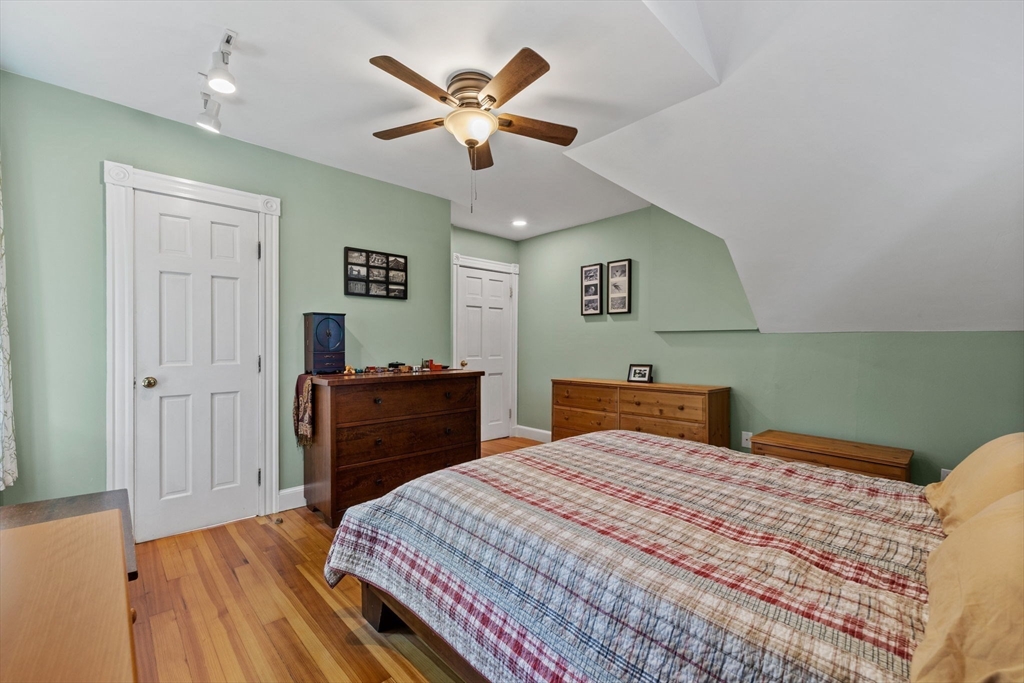 153 Ashcroft Road Medford, MA 02155 - Photo 19 of 39 a bedroom with a bed and a dresser