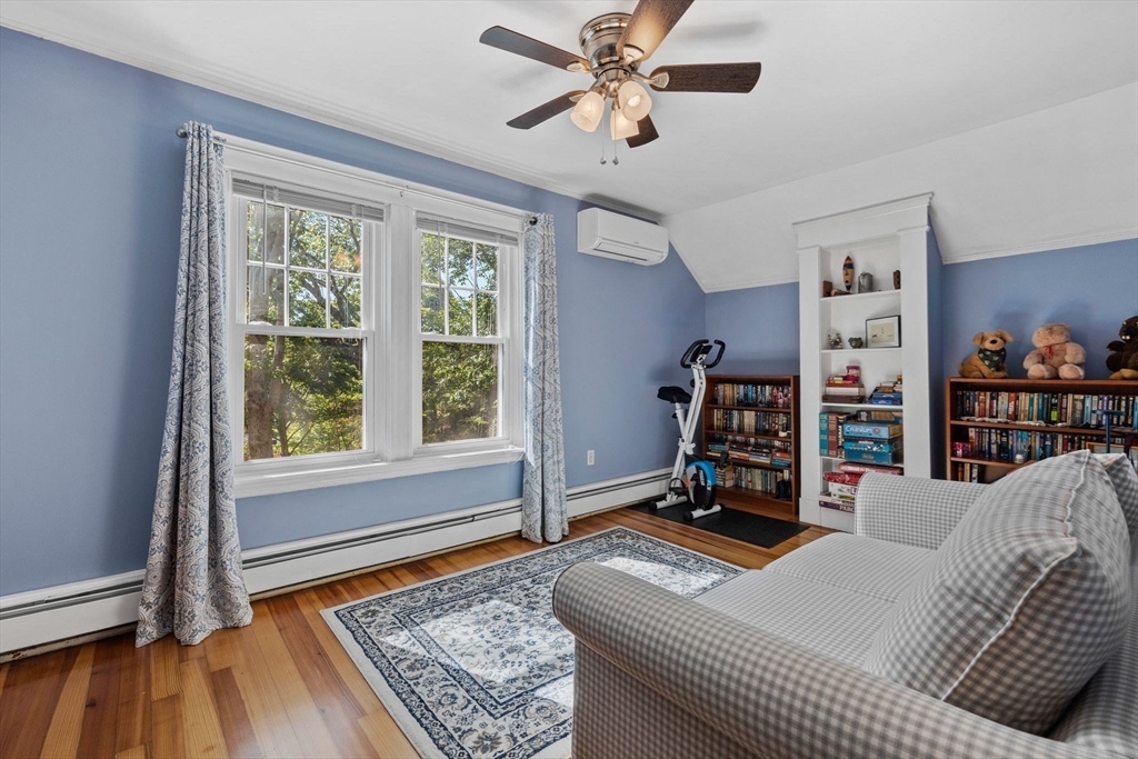 153 Ashcroft Road Medford, MA 02155 - Photo 22 of 39 a living room with furniture and a rug