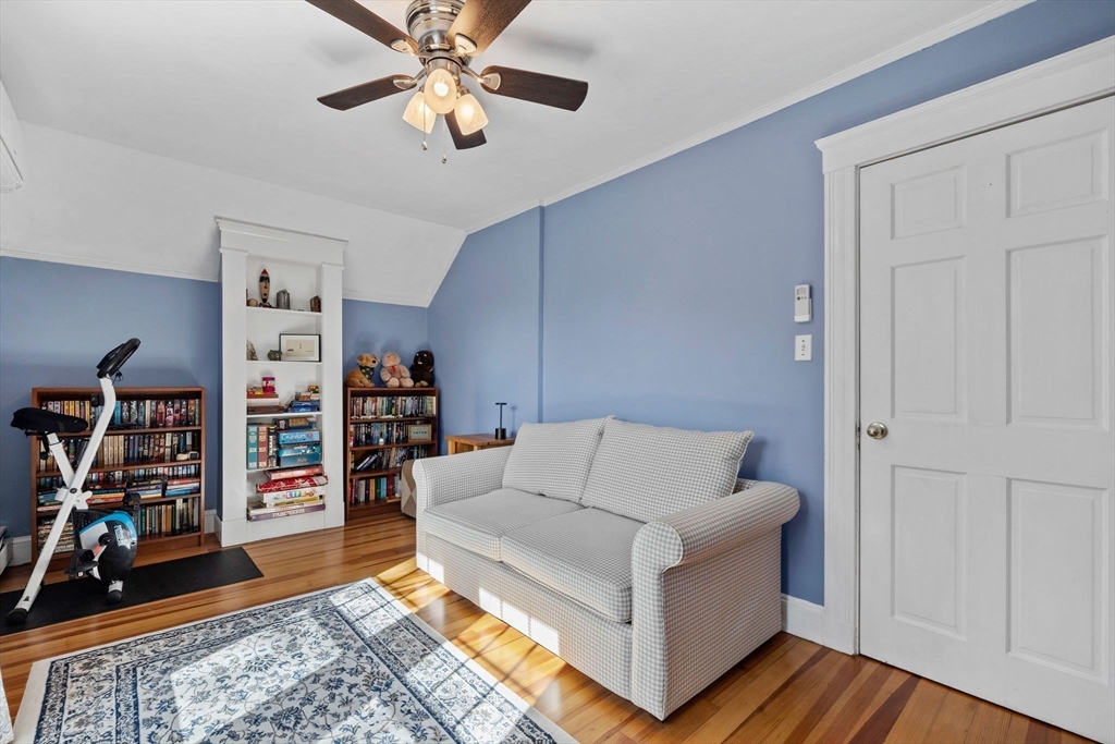 153 Ashcroft Road Medford, MA 02155 - Photo 23 of 39 a living room with furniture and a wooden floor