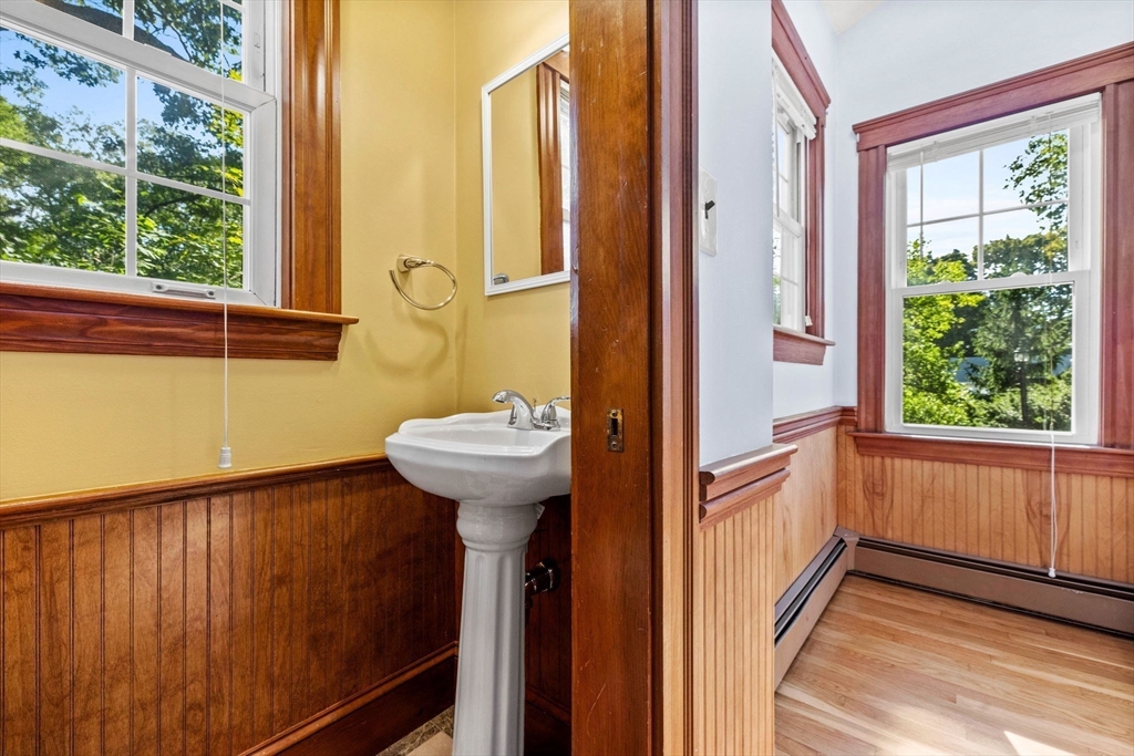 153 Ashcroft Road Medford, MA 02155 - Photo 31 of 39 a view of a bathroom with a sink and mirror