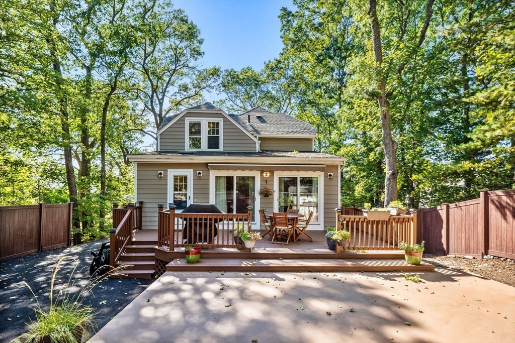153 Ashcroft Road Medford, MA 02155 - Photo 32 of 39 a front view of a house with a yard table and chairs