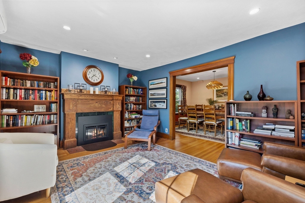 153 Ashcroft Road Medford, MA 02155 - Photo 7 of 39 a living room with furniture and a fireplace