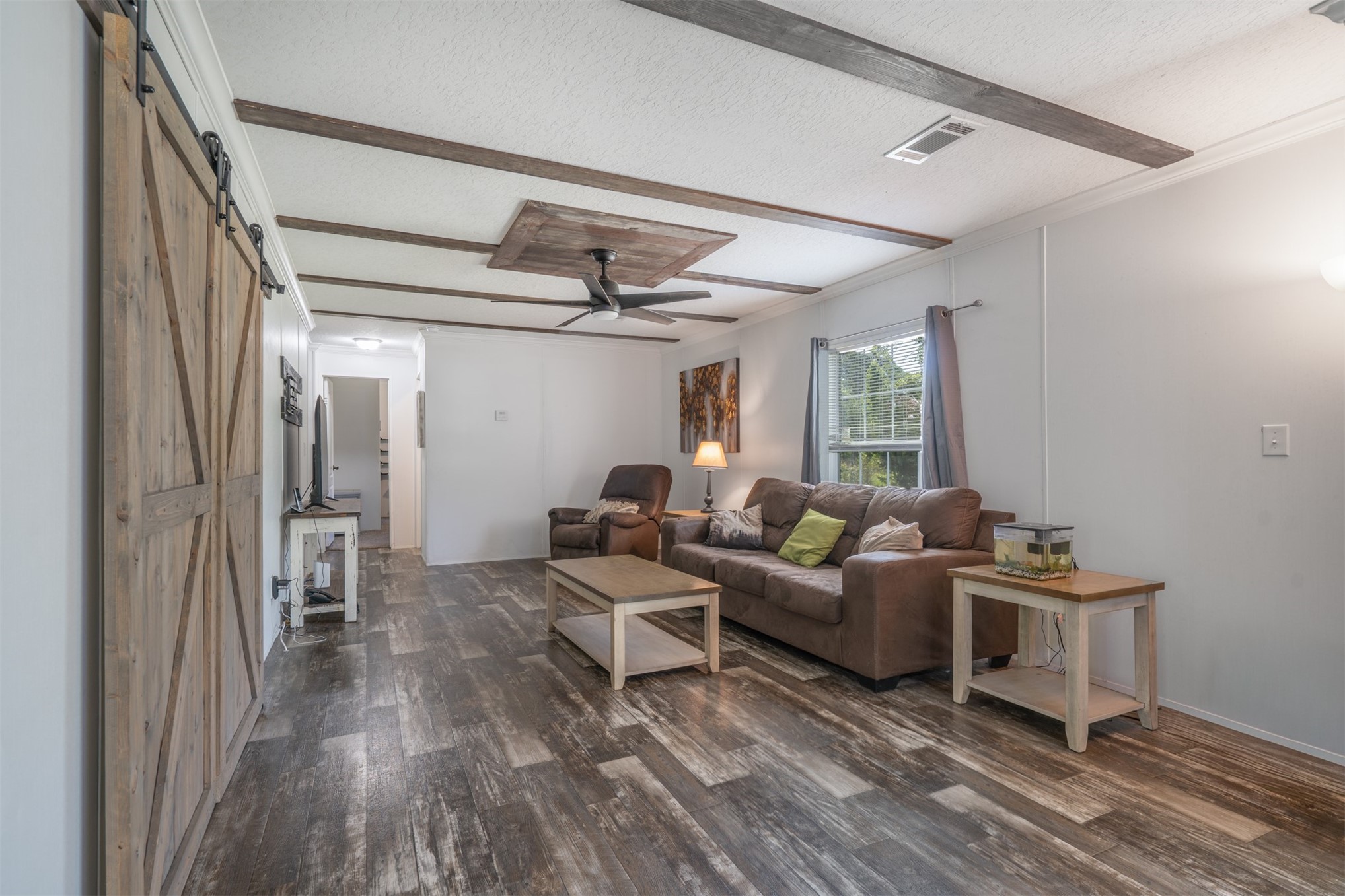76220 Dove Road Yulee, FL 32097 - Photo 16 of 48 a living room with furniture and a wooden floor