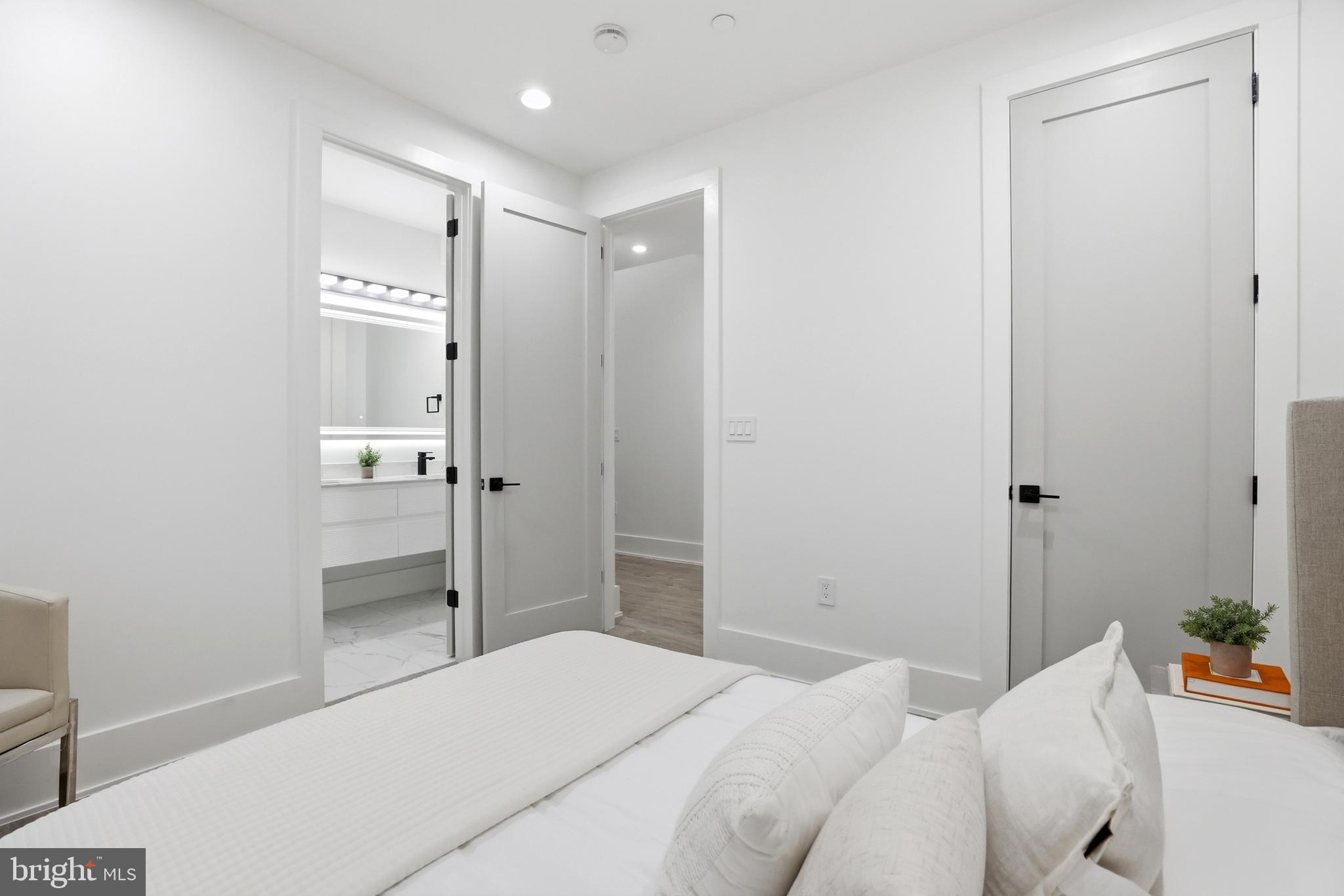 1140 Oates Street Northeast, Unit 101 Washington, DC 20002 - Photo 20 of 31 a bedroom with a bed and a shower