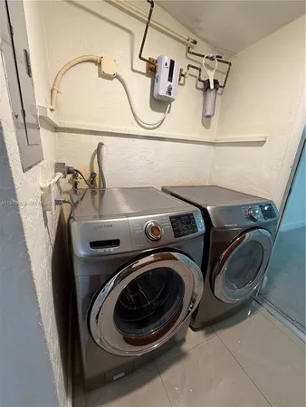 a utility room with dryer and washer