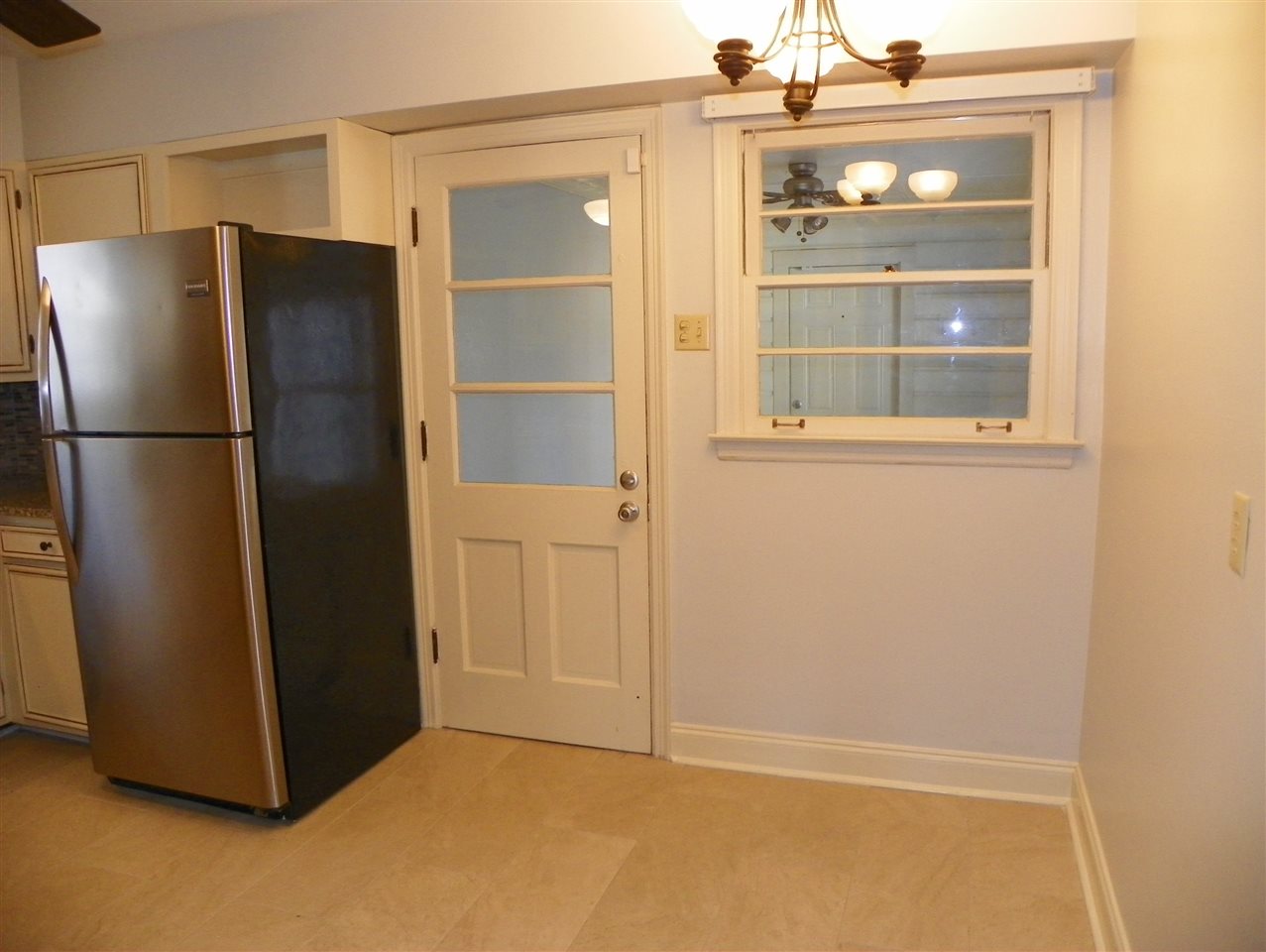 4053 Minden Road Memphis, TN 38117 - Photo 8 of 22 a view of a refrigerator in kitchen and wooden floor