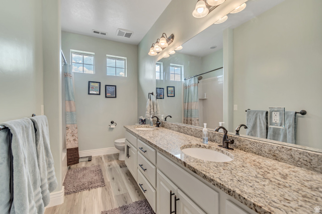 2543 East 700 South Springville, UT 84663 - Photo 35 of 73 Full bathroom with double vanity and light wood finished floors