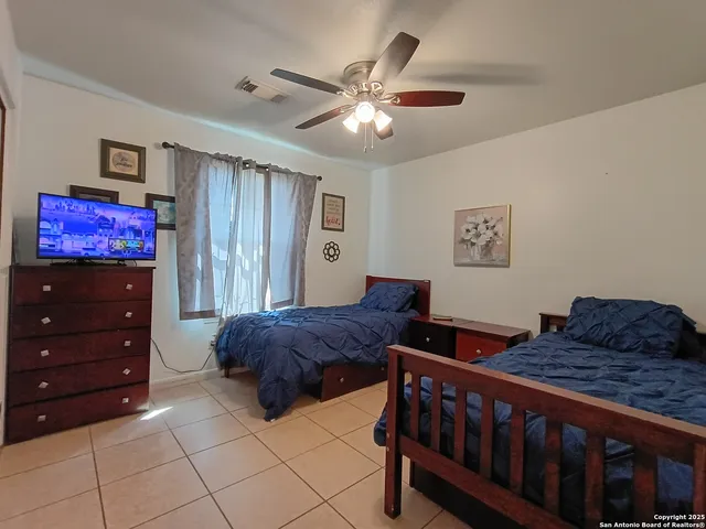 a bedroom with furniture and a dresser