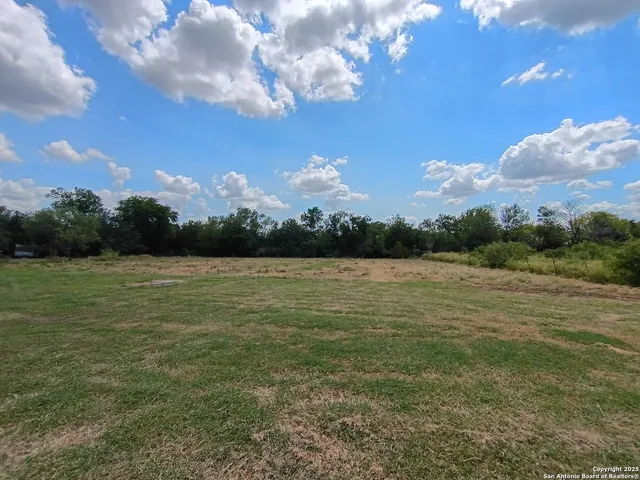 a view of lake with green space
