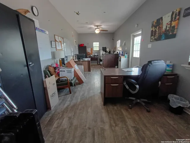 a view of a workspace with furniture and toys