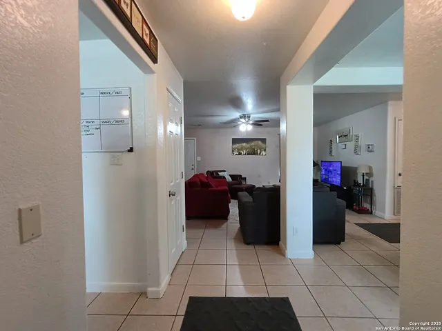 a kitchen with a refrigerator and a stove