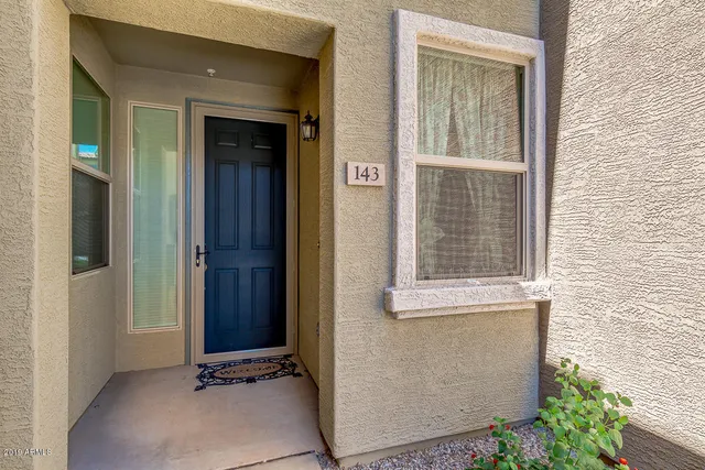front view of a house with a door and a window