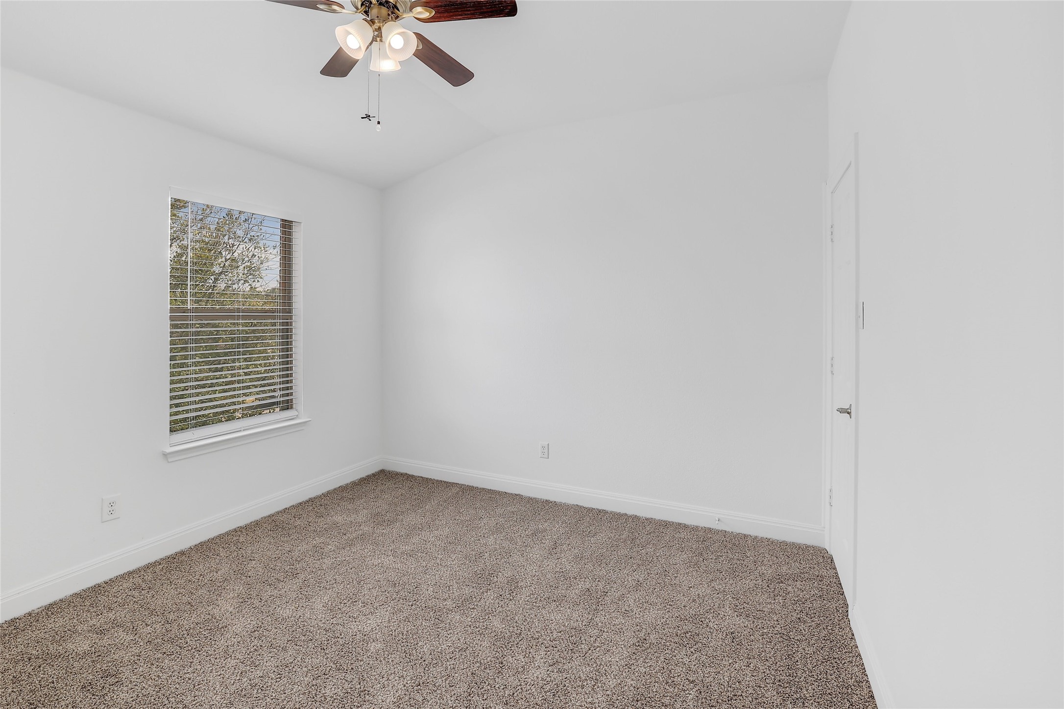 203 Ran Road Leander, TX 78641 - Photo 25 of 31 Soft carpeting pairs with neutral walls to create a comfortable, versatile bedroom space.