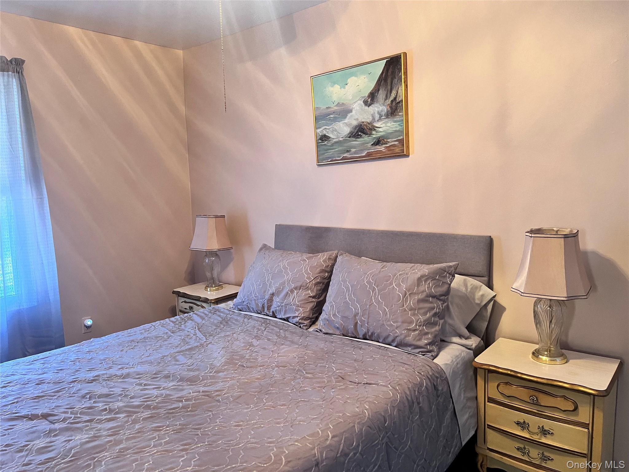 13 Herlings Road Wurtsboro, NY 12790 - Photo 12 of 37 a bedroom with a bed and lamp