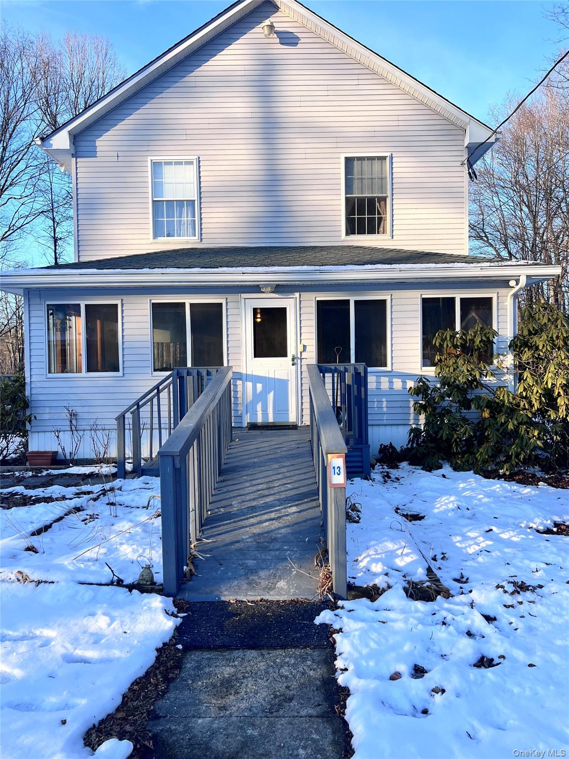 13 Herlings Road Wurtsboro, NY 12790 - Photo 26 of 37 a front view of house with yard outdoor seating and wooden floor