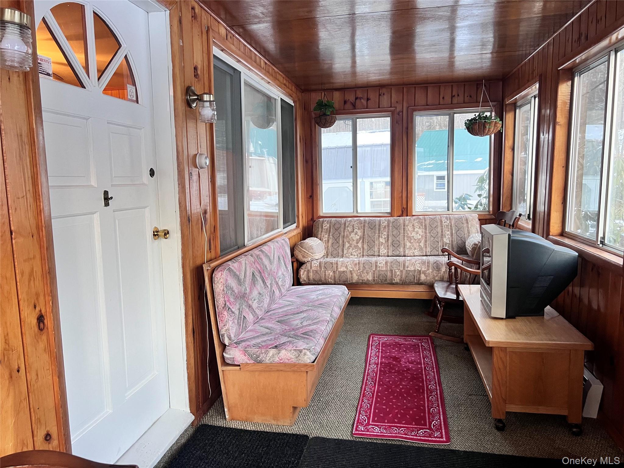 13 Herlings Road Wurtsboro, NY 12790 - Photo 3 of 37 Enclosed porch/sunroom.