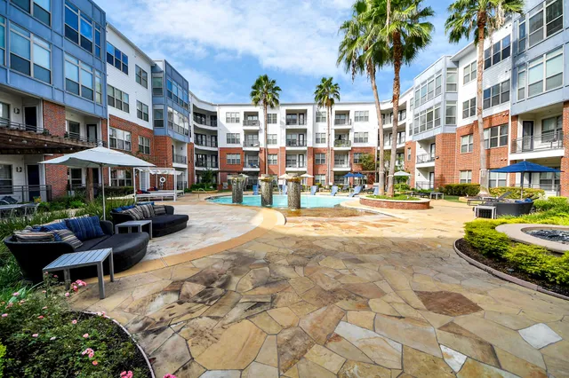 a bedroom with a large bed and a large window