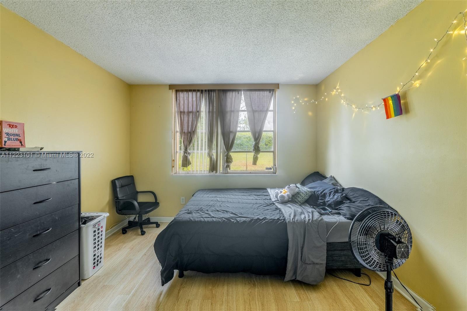3490 Foxcroft Road, Unit B103 Miramar, FL 33025 - Photo 24 of 37 a bedroom with a bed and a window