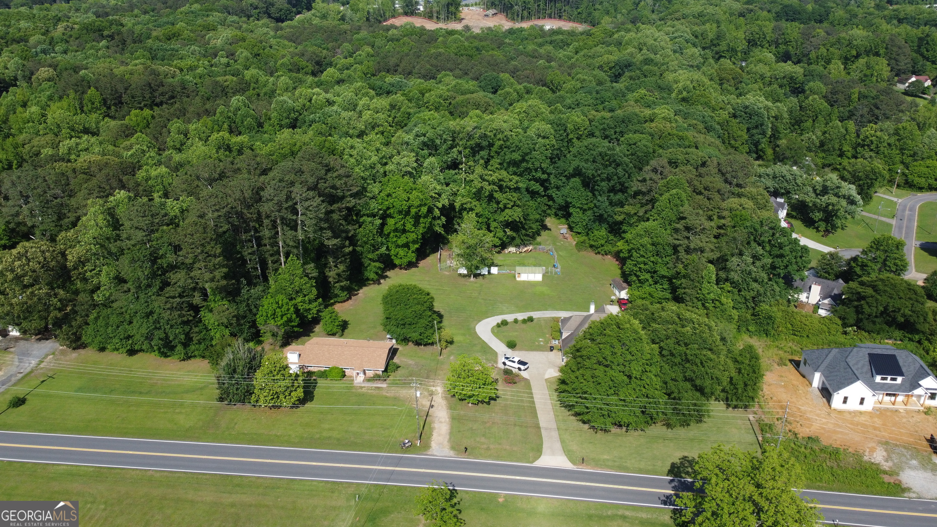 3487 Kellogg Creek Road Acworth, GA 30102 - Photo 1 of 16 an aerial view of a residential houses with yard