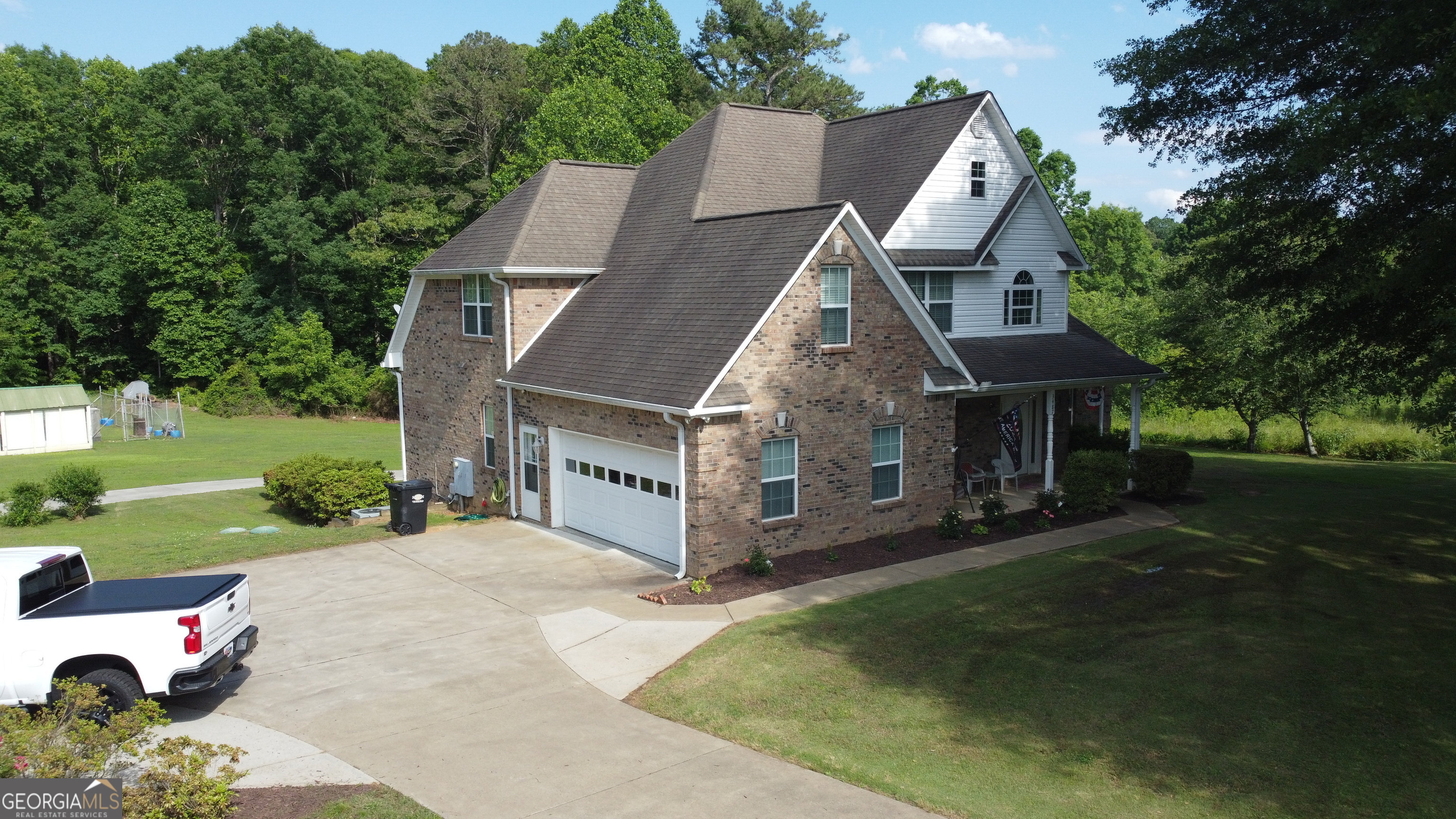 3487 Kellogg Creek Road Acworth, GA 30102 - Photo 14 of 16 a view of a house with a yard garden and sitting area