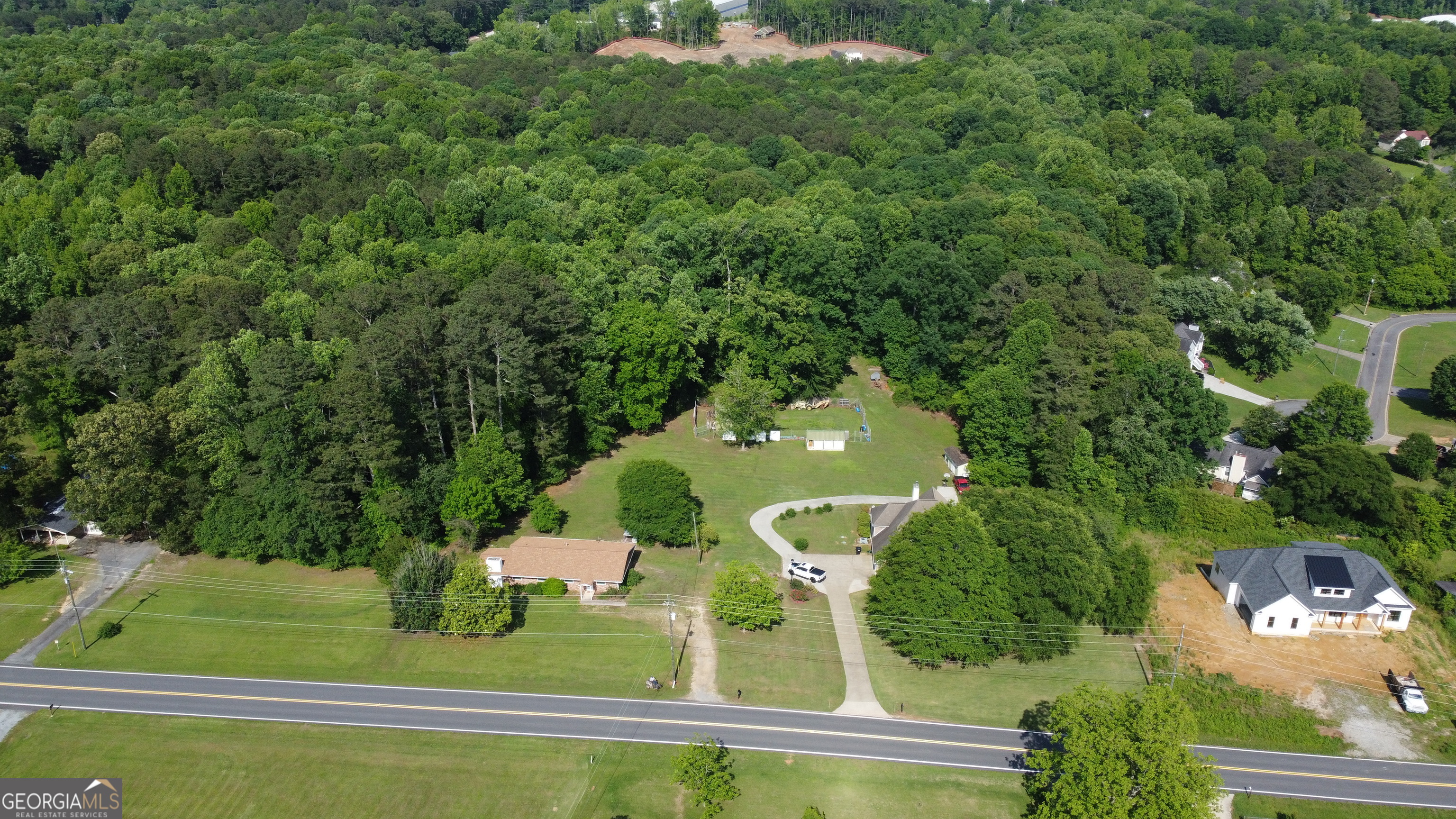 3487 Kellogg Creek Road Acworth, GA 30102 - Photo 2 of 16 an aerial view of a house with a yard basket ball court and outdoor seating