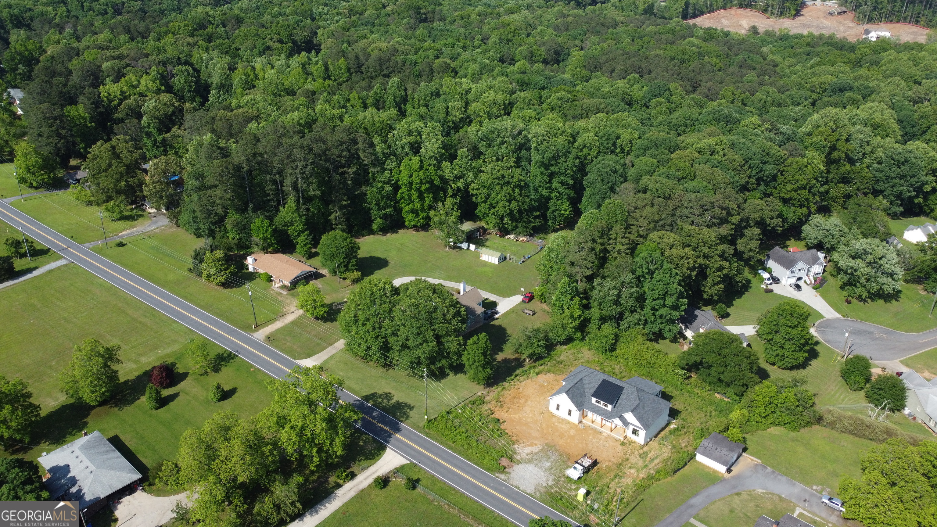 3487 Kellogg Creek Road Acworth, GA 30102 - Photo 5 of 16 an aerial view of a house with a yard swimming pool and outdoor seating