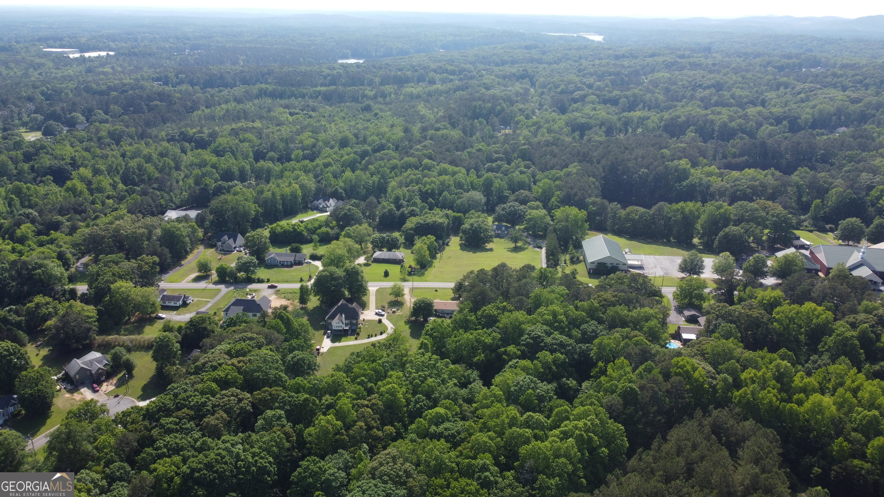3487 Kellogg Creek Road Acworth, GA 30102 - Photo 7 of 16 an aerial view of residential house with outdoor space and trees all around
