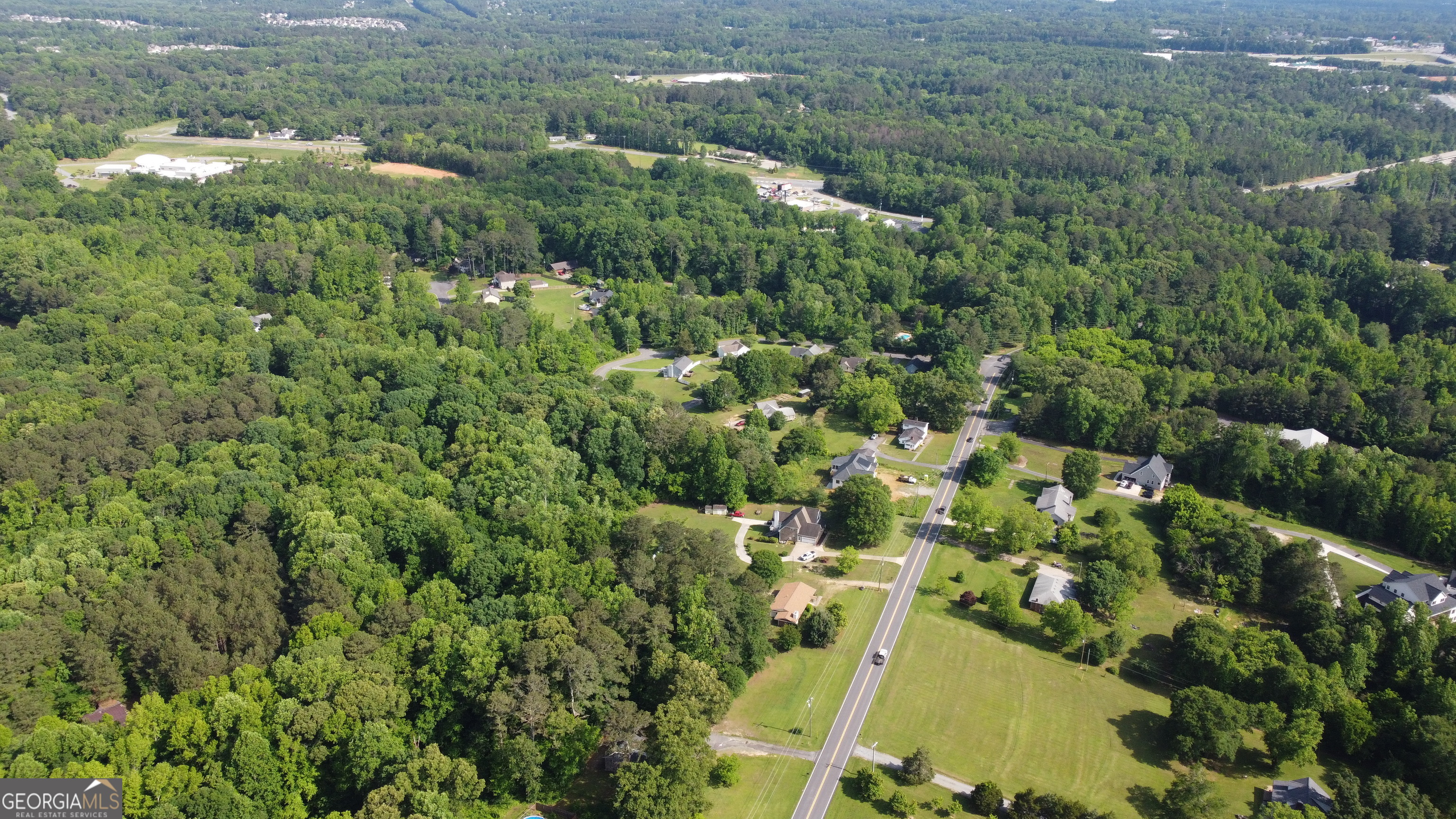 3487 Kellogg Creek Road Acworth, GA 30102 - Photo 9 of 16 an aerial view of residential houses with outdoor space and trees