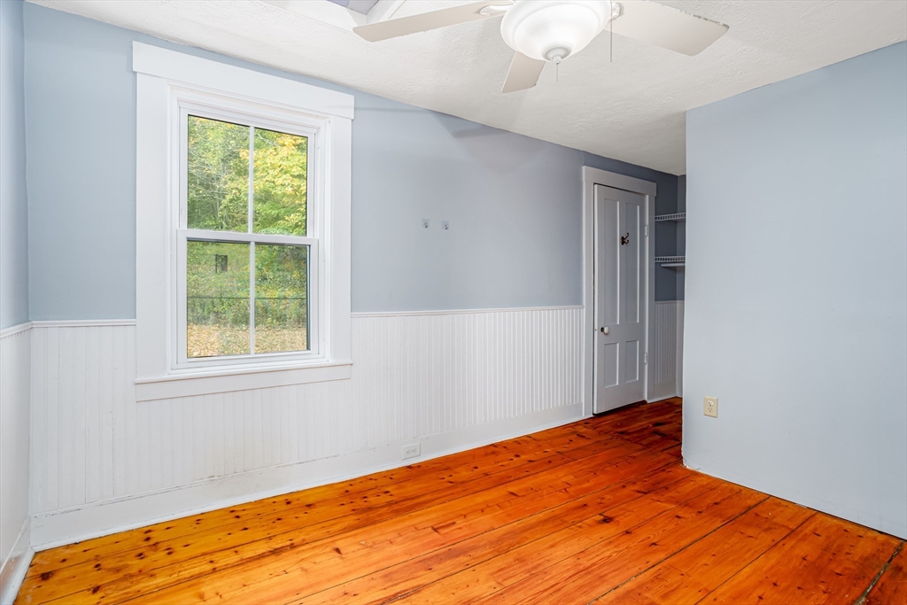 5 River Styx Road Ashburnham, MA 01430 - Photo 19 of 36 a view of empty room with wooden floor and fan