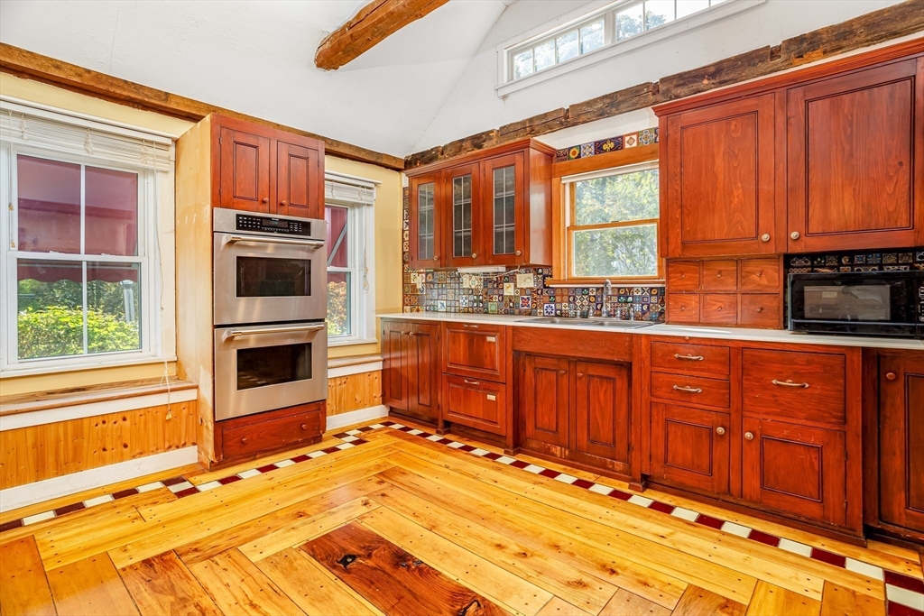 5 River Styx Road Ashburnham, MA 01430 - Photo 4 of 36 a kitchen with stainless steel appliances granite countertop a stove a sink and a microwave