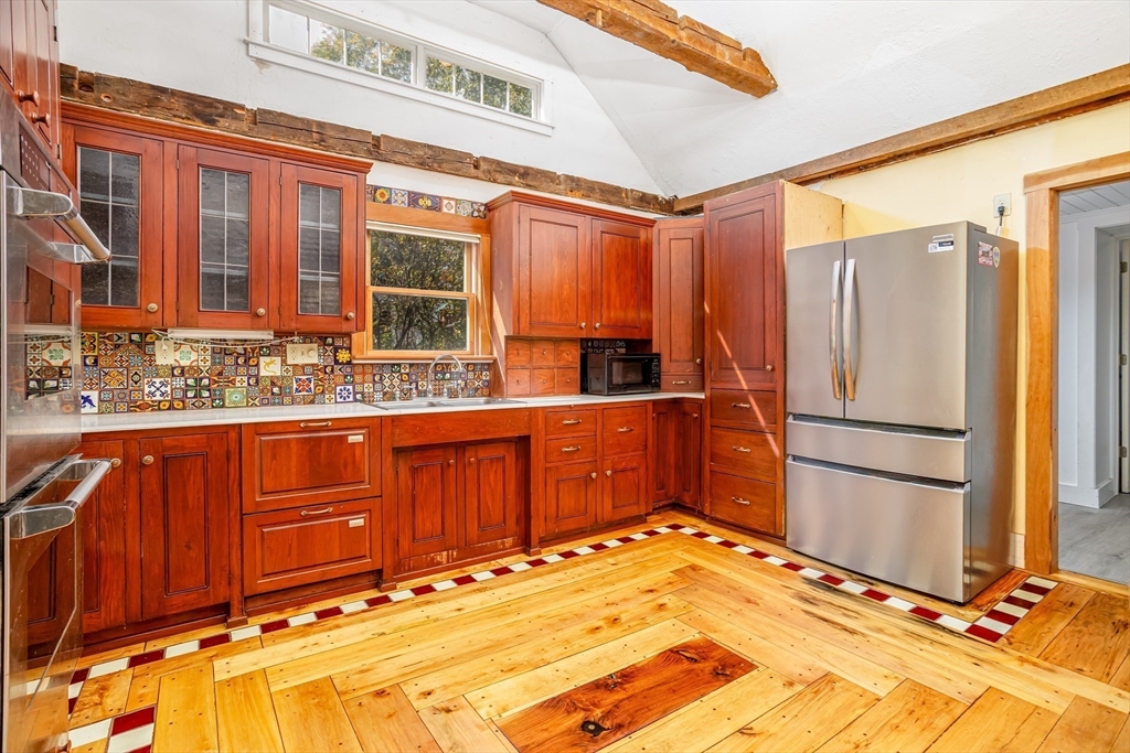 5 River Styx Road Ashburnham, MA 01430 - Photo 5 of 36 a kitchen with stainless steel appliances granite countertop a refrigerator and a sink