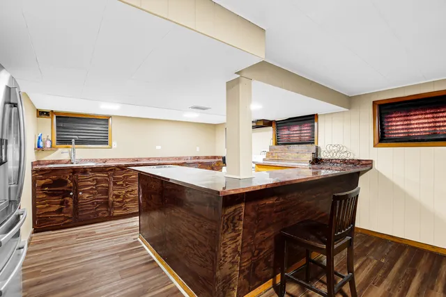 a kitchen with stainless steel appliances granite countertop a stove and a sink