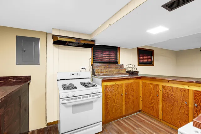 a kitchen with stainless steel appliances a stove a sink and a refrigerator