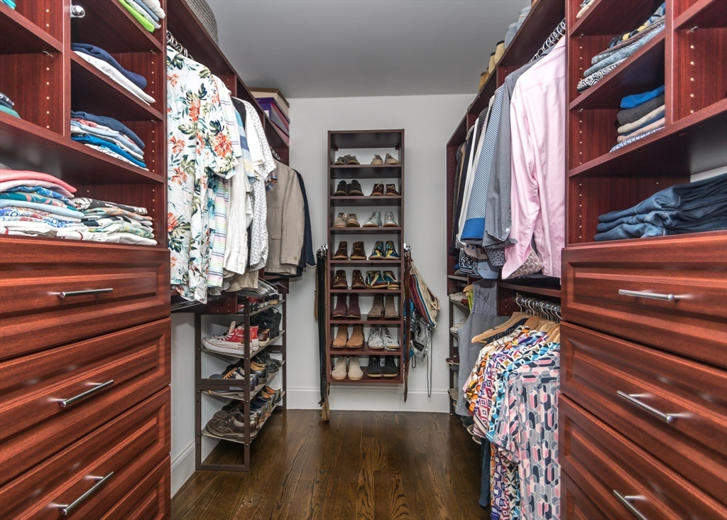 128 Church Street, Unit 2 Waltham, MA 02452 - Photo 30 of 41 a view of walk in closet with clothes and shoes