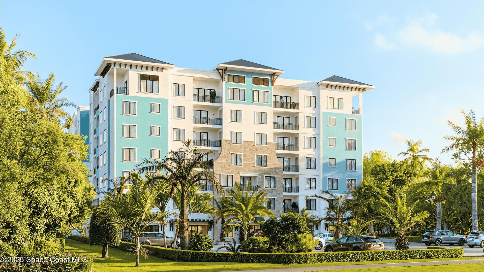 1230 Jimmy Buffett Mem Highway, Unit 411 Satellite Beach, FL 32937 - Photo 1 of 14 a front view of a multi story building