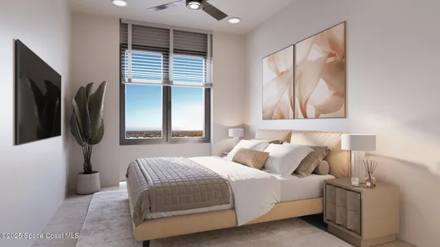 a bedroom with a bed a flat screen tv and window