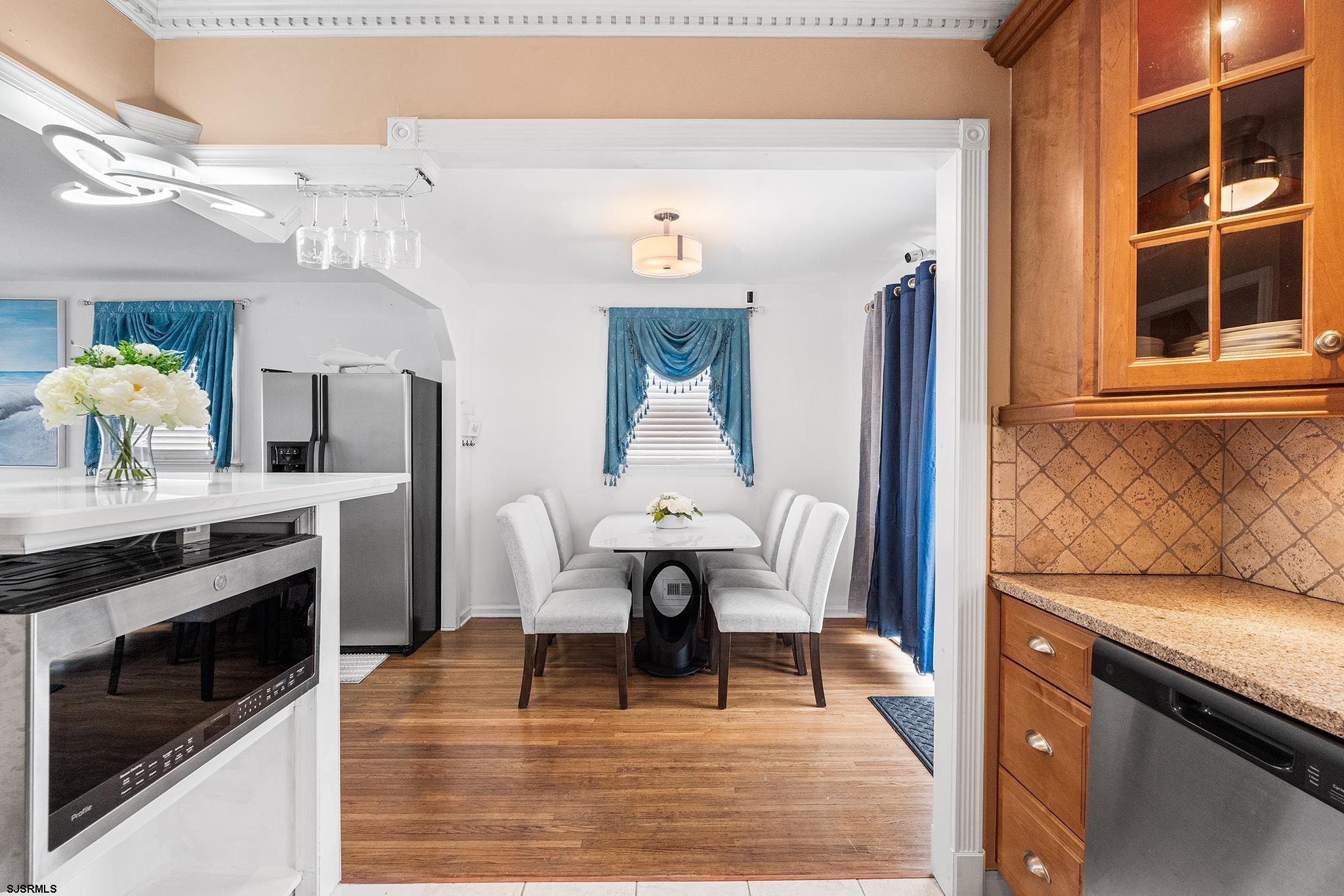 128 Devon Road Somers Point, NJ 08244 - Photo 12 of 40 a living room with furniture wooden floor and a fireplace