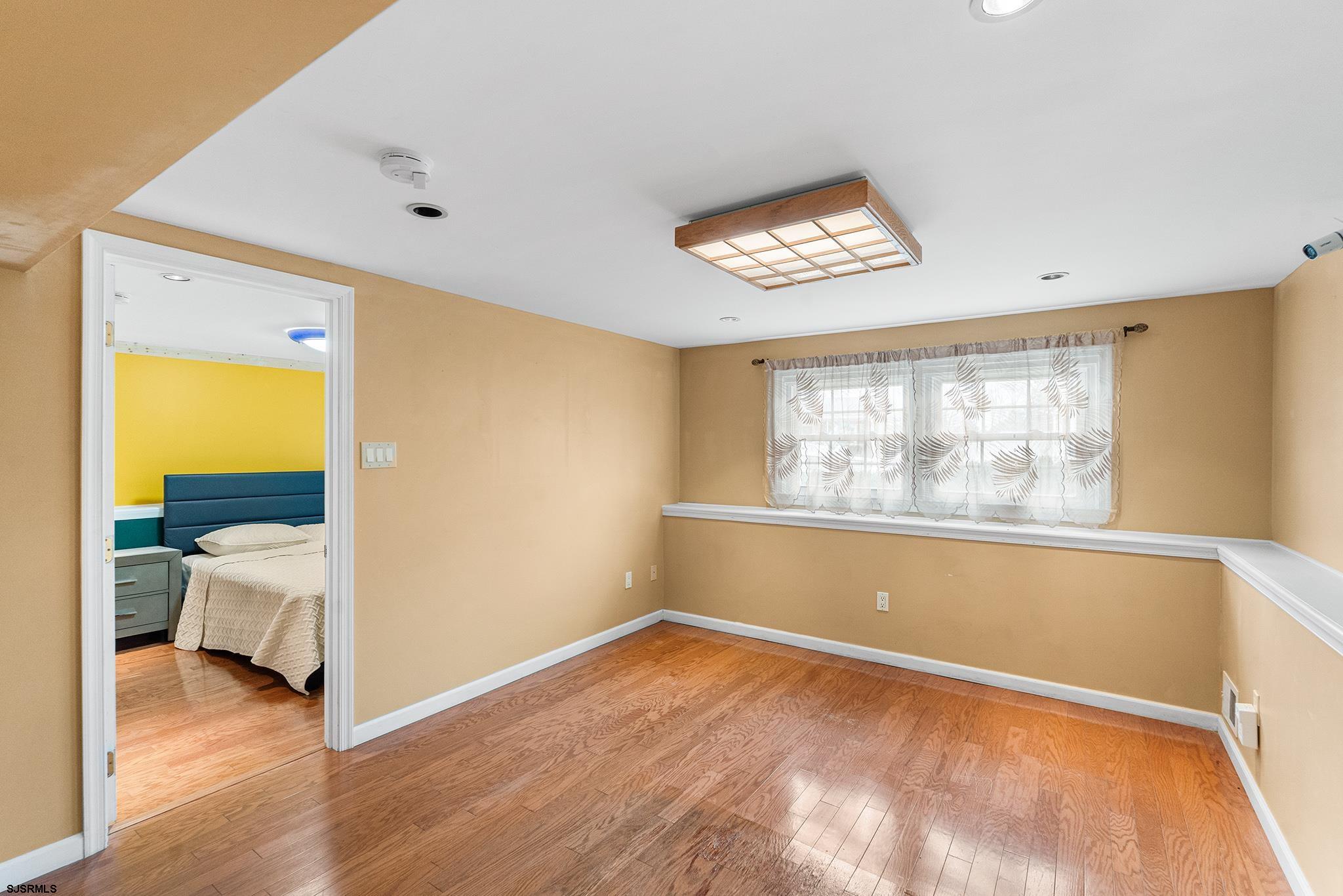 128 Devon Road Somers Point, NJ 08244 - Photo 14 of 40 a view of an empty room with a window