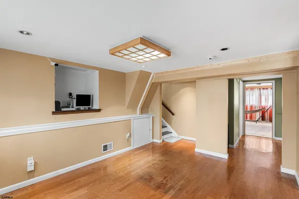 a view of an entryway with wooden floor