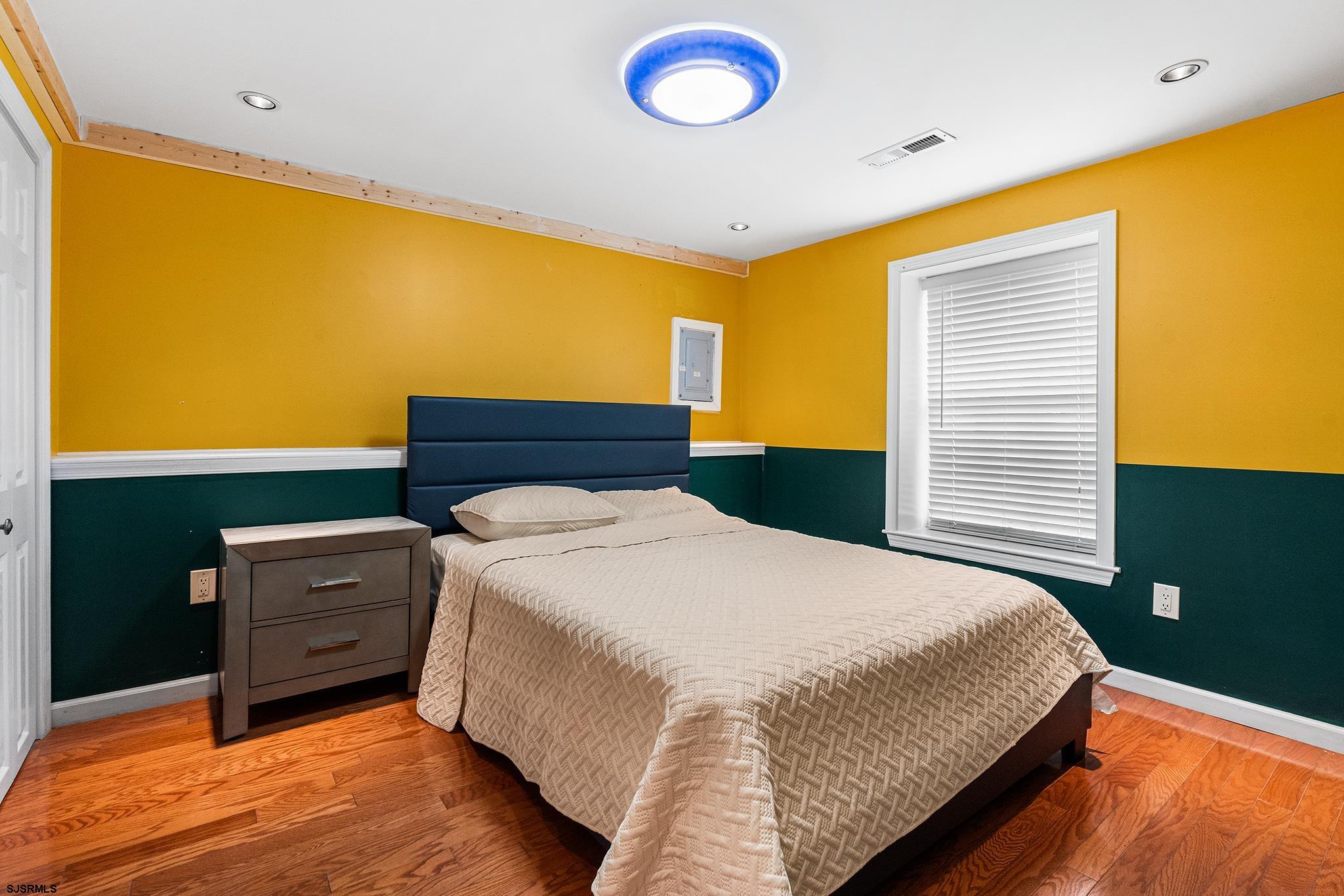 128 Devon Road Somers Point, NJ 08244 - Photo 16 of 40 a bedroom with a bed and a window