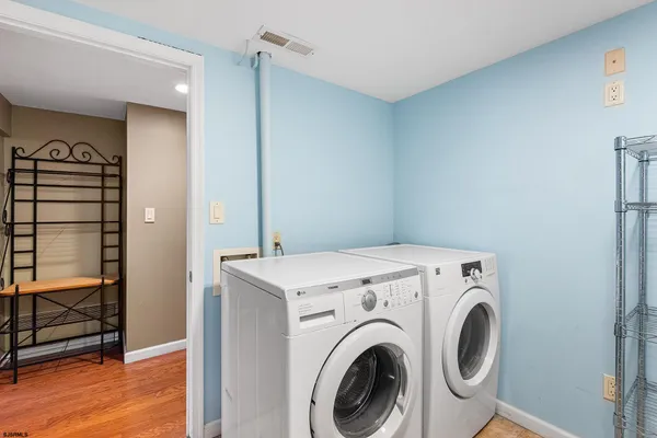 a view of storage and utility room with washer and dryer
