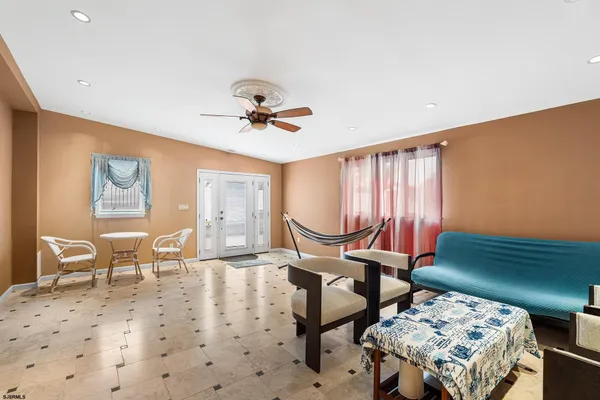 a living room with furniture and a window