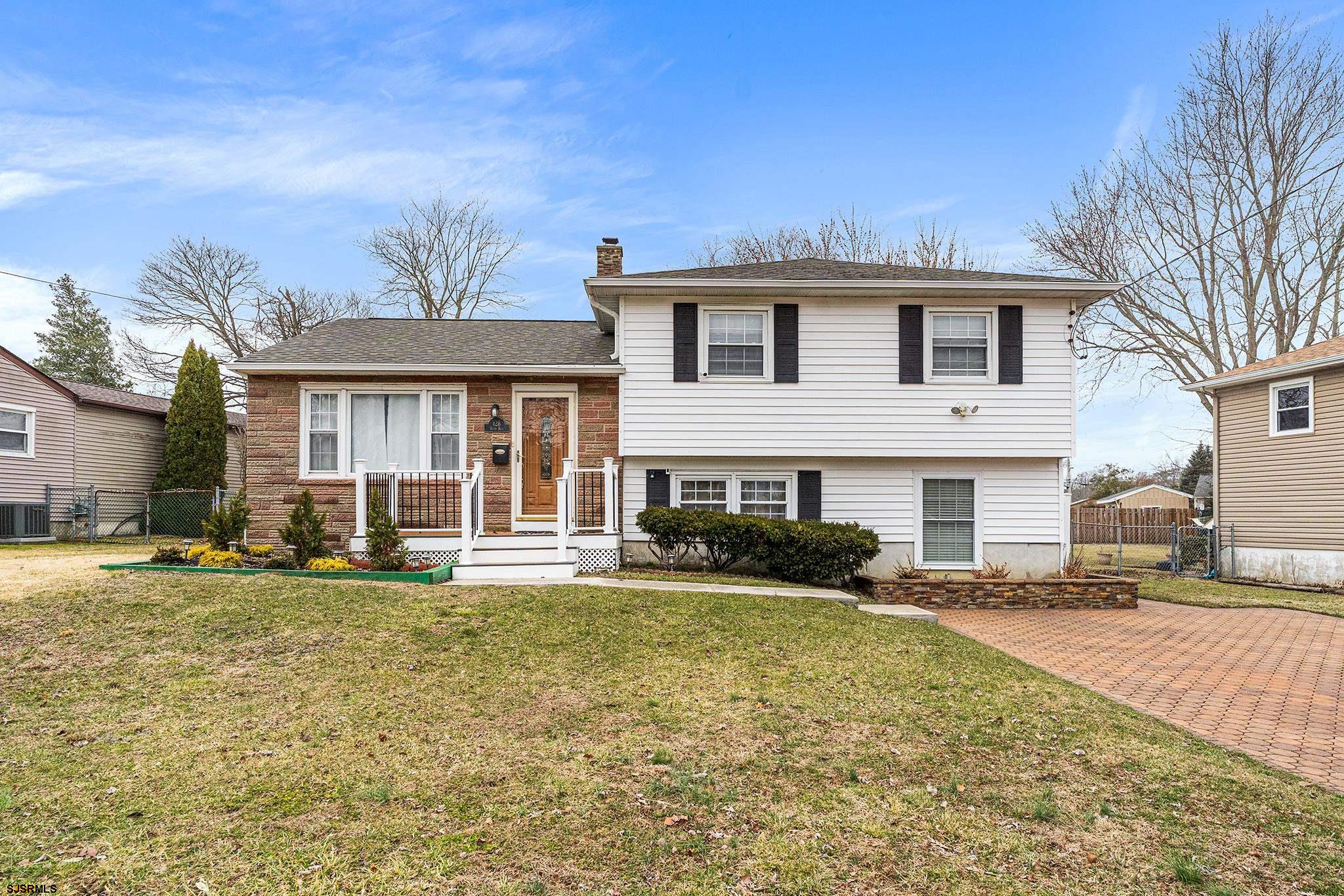 128 Devon Road Somers Point, NJ 08244 - Photo 2 of 40 a view of a yard in front of house