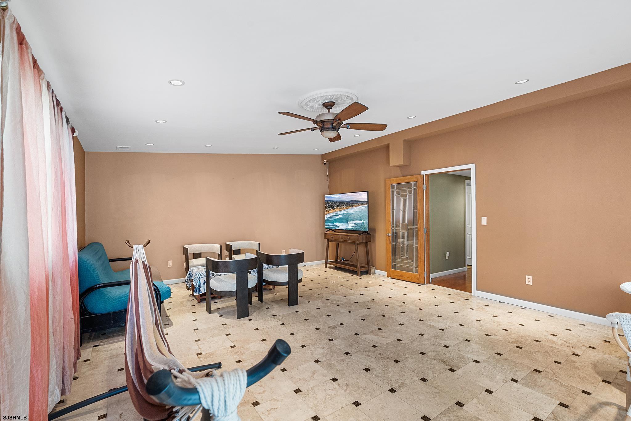 128 Devon Road Somers Point, NJ 08244 - Photo 21 of 40 a bedroom with furniture and a window